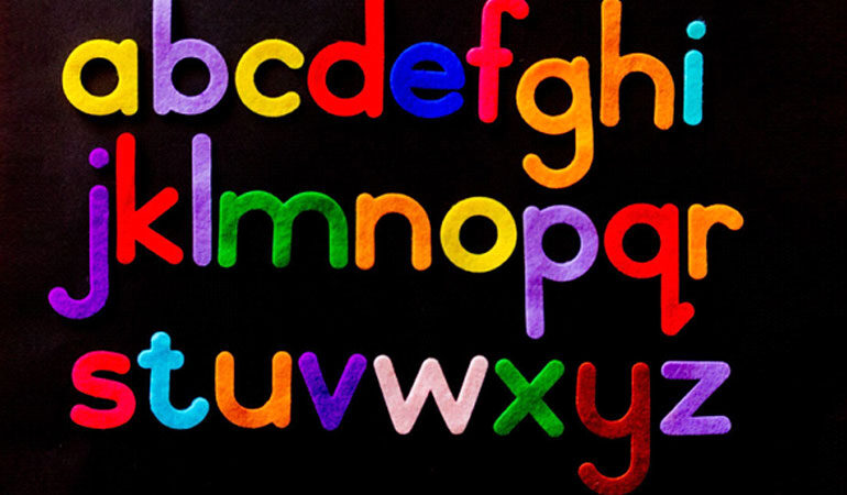Colorful lowercase letters of the alphabet against a black background