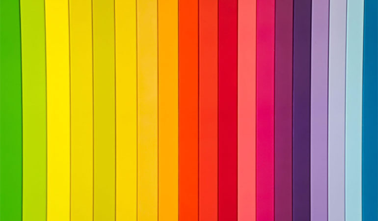Vertical rainbow stripes ranging from green to yellow to orange to red to pink to purple to blue